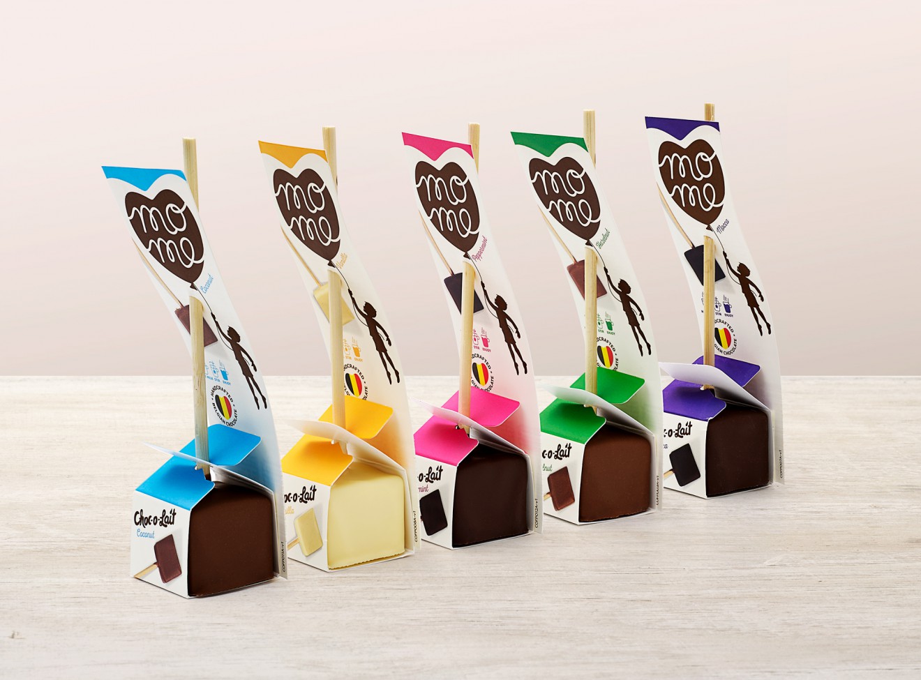 Quatre Mains package design - chocolate on a stick, cube, treats